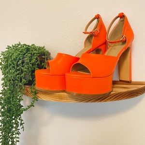 Orange platform heel.